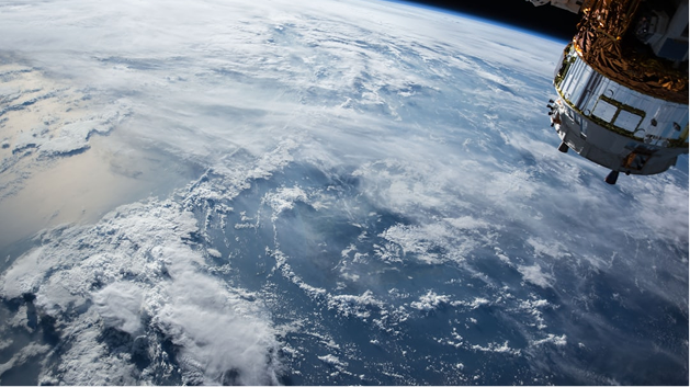 Satellite in orbit above Earth representing NTN connectivity for global IoT networks